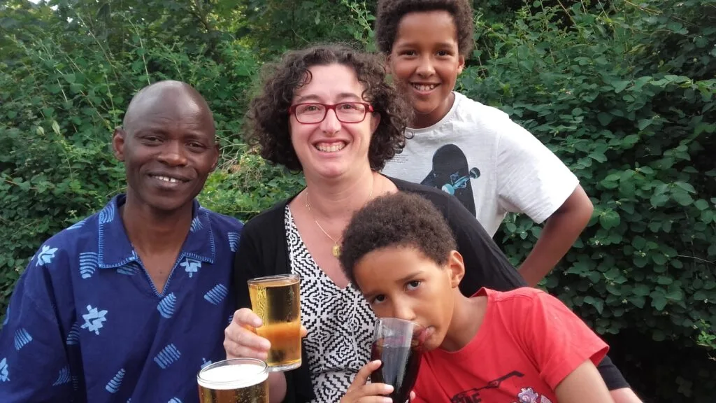 multicultural family at the pub smiling