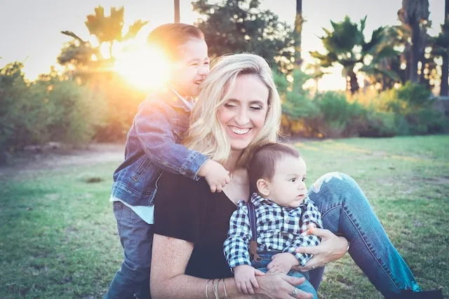 Mother smiling with the sun shining happy life