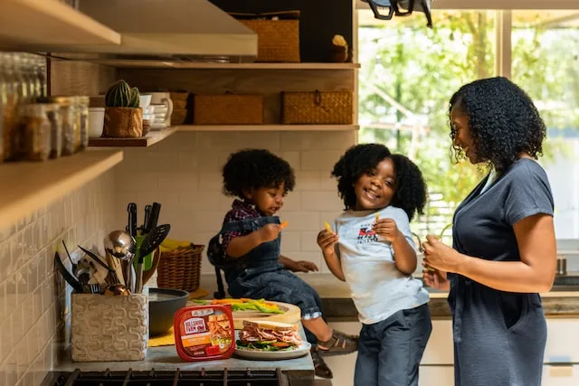 Mother laughing with her children coaching