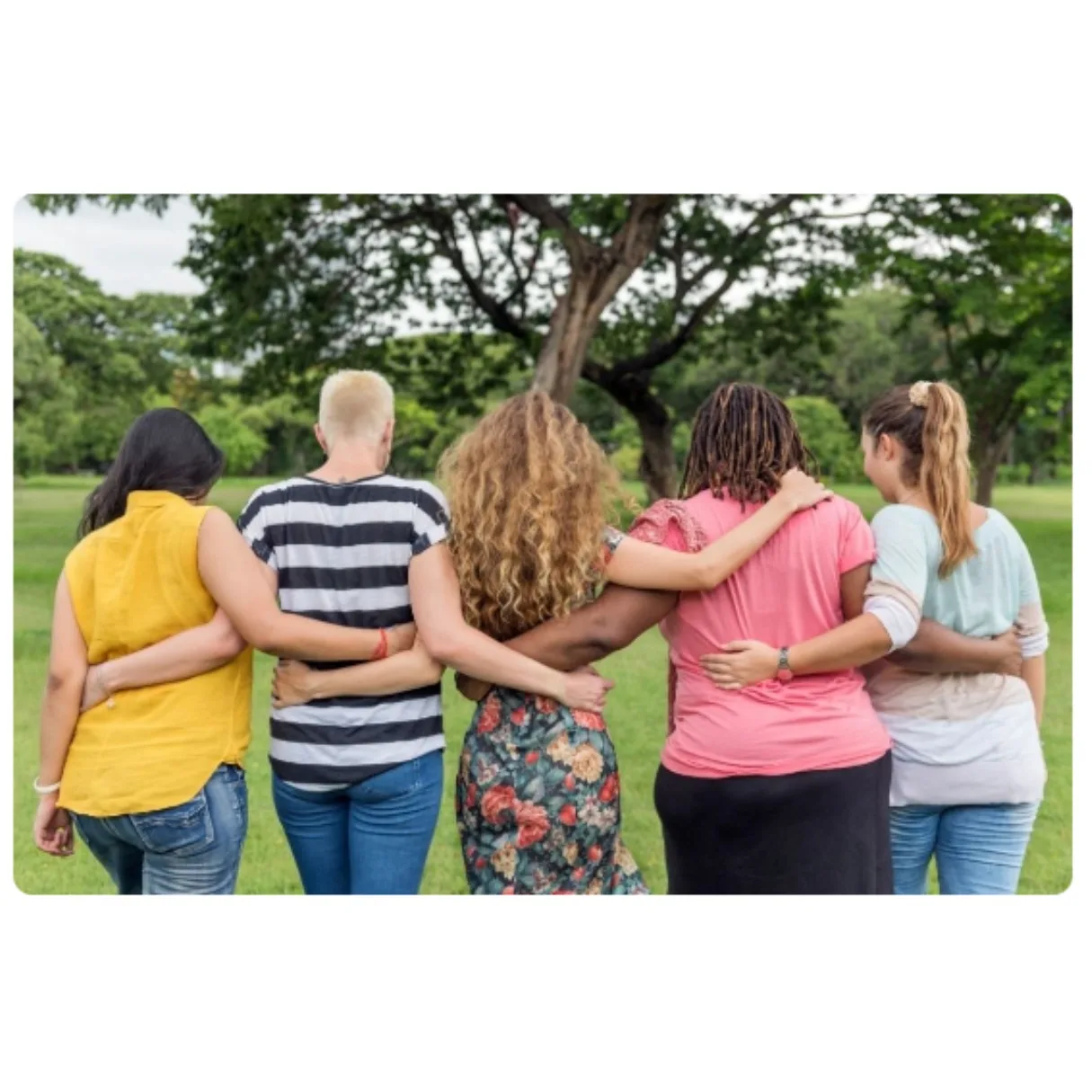 several women supporting each others by holding at the waist