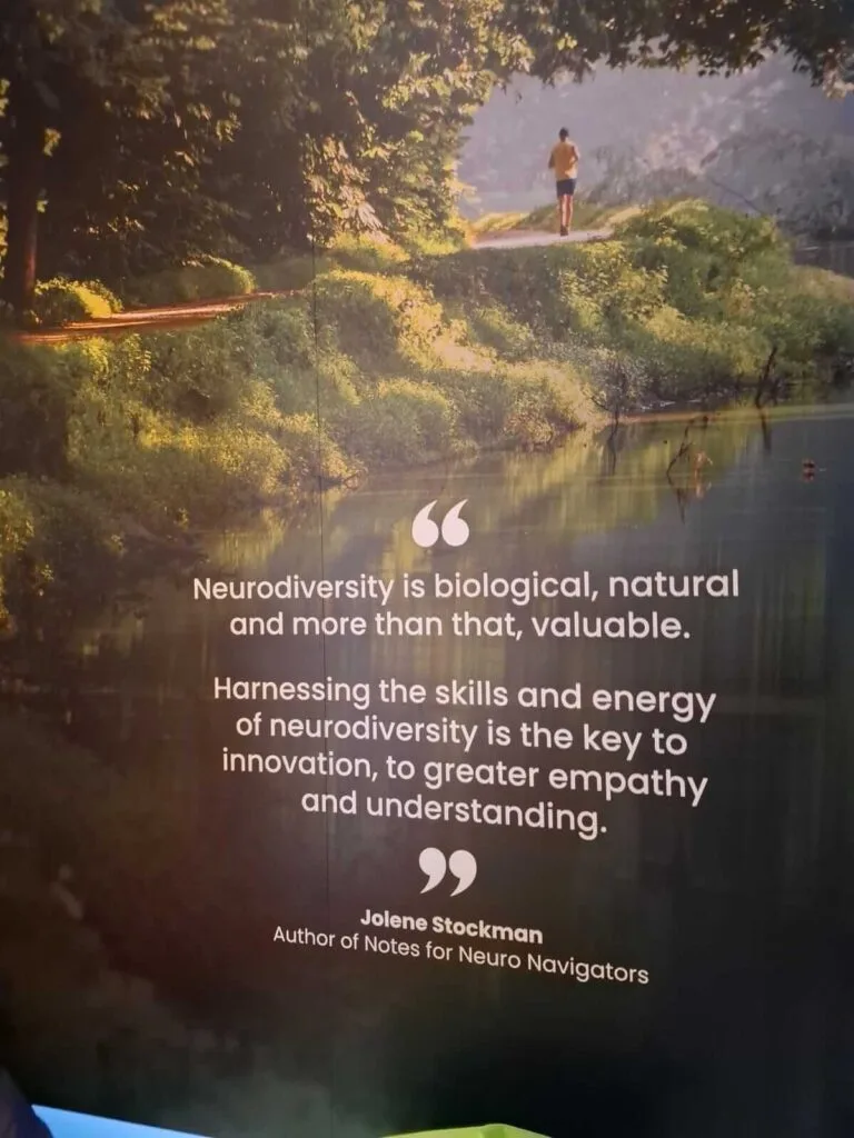 A banner of nature with white text reading, " Neurodiversity is biological, natural and more than that, valuable."