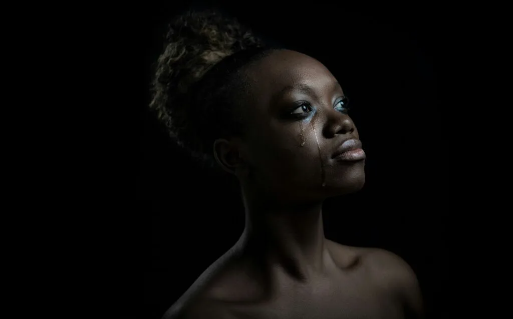 black woman crying